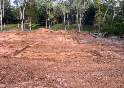 Footer excavation dug to depth on a prepped building pad